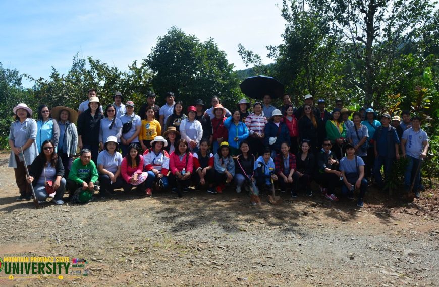 University personnel conduct tree-planting activity