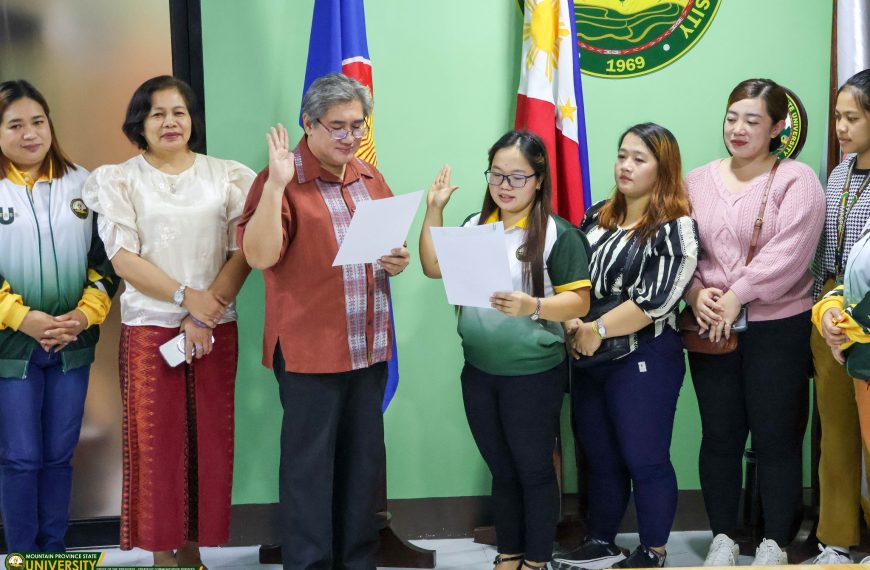 Dr. Edgar G. Cue Administers Oath to Promoted Instructor May Joy G. Mongo